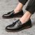 Miesten tupsukoristeiset loaferit