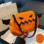 Halloween-kurpitsaolkalaukku siivillä